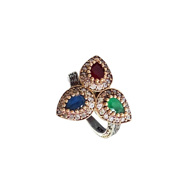 This fabulous vintage hand made sterling silver statement ring from Jaipur India features ruby ,emerald and sapphire and...