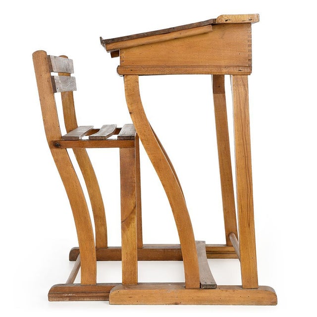 This wooden “Jouets Clerc” desk is a fine example of yesteryear’s school furniture, designed to support children in their...