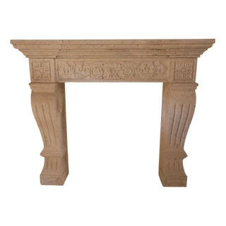 20th Century French Carved Limestone Fireplace with Scrolled Jambs For Sale