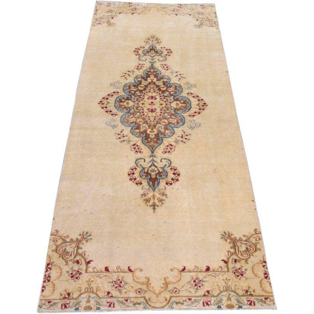 Hand-knotted with care using traditional rug-making techniques, this wool rug blends timeless craftsmanship with a modern...