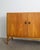 A rare danish mid century wooden "232" cabinet / sideboard in stained oak with and pair of iconic and decorative brass...