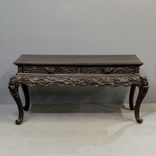 Antique free standing Japanese hand carved console table or desk with bird and floral motif. The hardwood has a dark red...