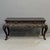 Antique free standing Japanese hand carved console table or desk with bird and floral motif. The hardwood has a dark red...