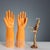 A set of six orange porcelain molds for pirelli gloves. Pirelli used to make latex gloves using porcelain matrices...