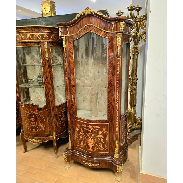 Make a statement with this grand French Louis XV-style display cabinet, crafted from solid, heavy wood and richly...