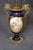 This impressive pair of French Sèvres-style porcelain vases, dating to the turn of the nineteenth and twentieth centuries...