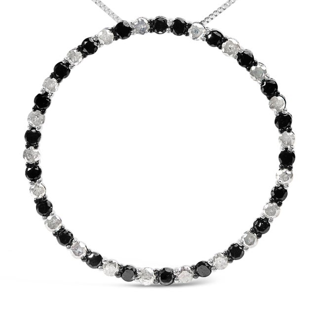 Discover an enchanting interplay of light and darkness wrapped elegantly around your neck with this exquisite pendant...