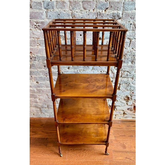 Elegant Regency-style etagere featuring faux bamboo detailing and smooth-rolling casters for effortless repositioning....