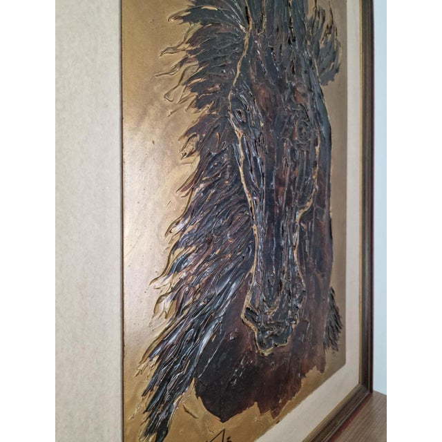 Horse portrait signed TARGA. A relief piece that gives it a highly textured and dynamic appearance. Framed in a style...
