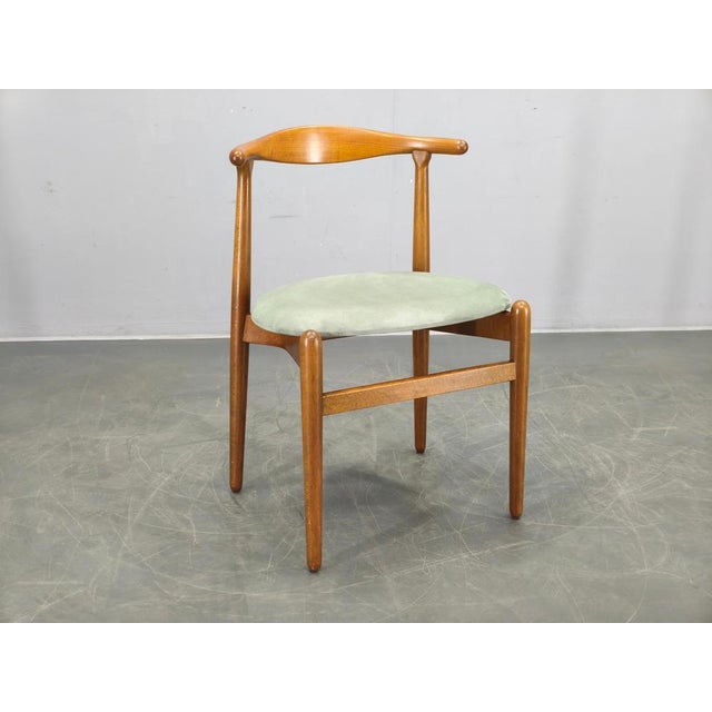 Danish modern side chair designed by Hans J. Wegner, model 708, and produced by Fritz Hansen in the 1960s. Crafted from...
