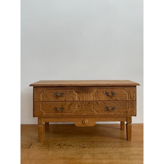 Bring a touch of organic Danish modernism into your home with this stunning low chest, designed in the unmistakable style...