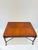 A richly detailed vintage coffee table in the style of Maitland-Smith, combining a beautifully figured wood top with...