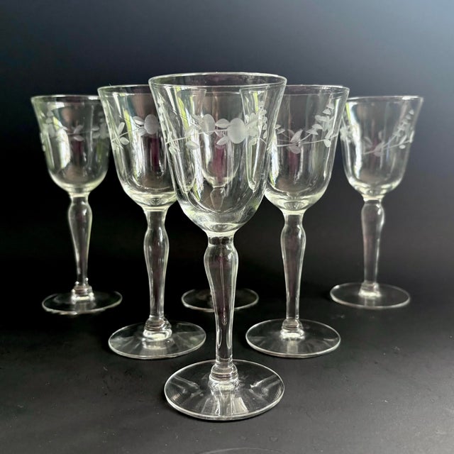Gorgeous set of 6 vintage wine glasses, dating to the 1950s. These mid-century glasses feature a refined etched floral...