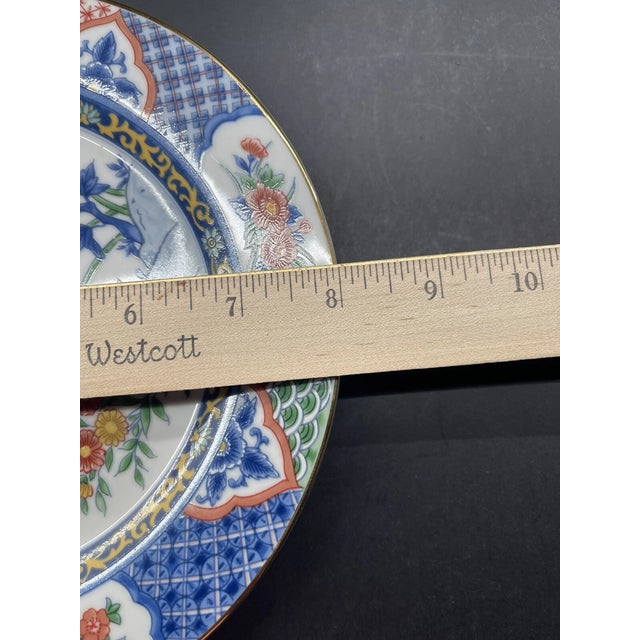 Beautiful and richly detailed, this set of four Imari Court Globus salad/dessert plates features the elegant #0542...