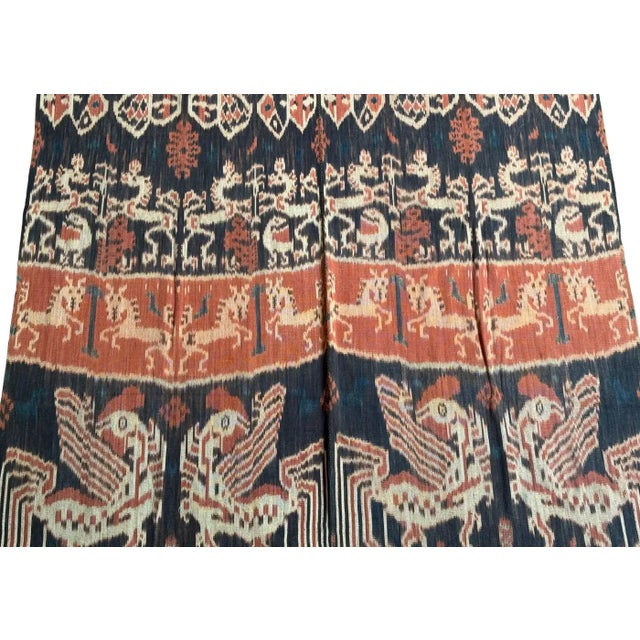 This ikat textile from Sumba, Indonesia is a striking example of the island’s rich weaving tradition, celebrated for its...