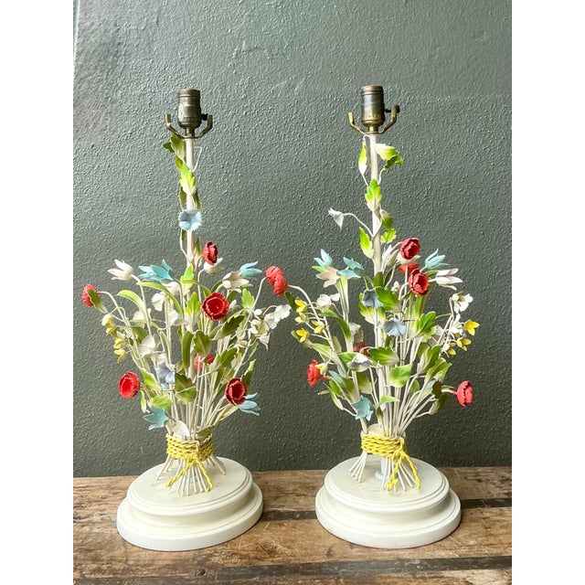 This charming pair of vintage tole table lamps captures the whimsical elegance of mid-20th-century decorative lighting....