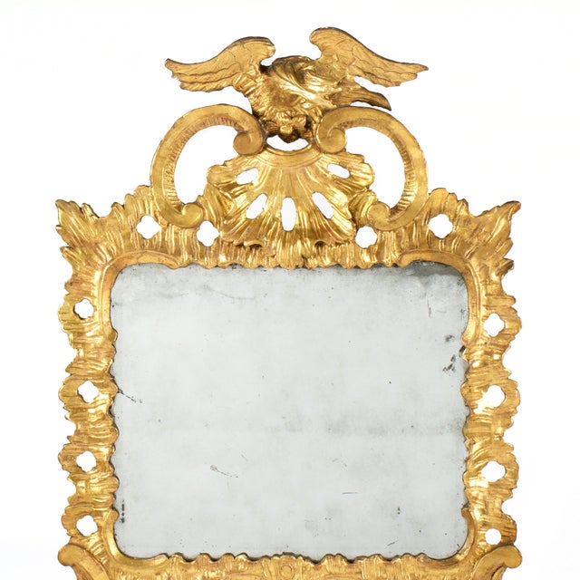 A Fine 18th Century Georgian Carved Giltwood Wall Mirror. Mirror features figural eagle with outstretched wings that is a...