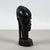This refined carved female bust, crafted in a vintage african style, represents an example of ethnic art with a powerful...