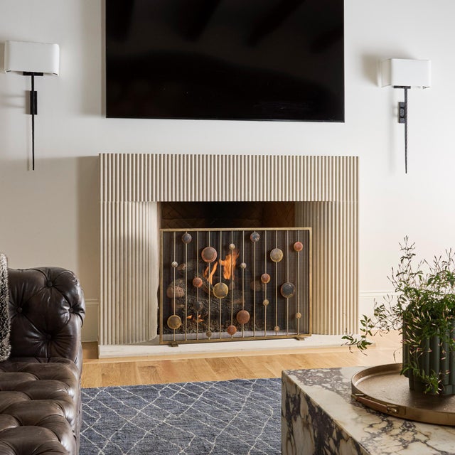 Inspired by the rhythm and balance of mid-century modern design, the Striker Fireplace Screen brings a sculptural presence...