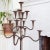 This rustic antique floor-standing candle holder features 13 graceful arms (one over four over four) that terminate in...