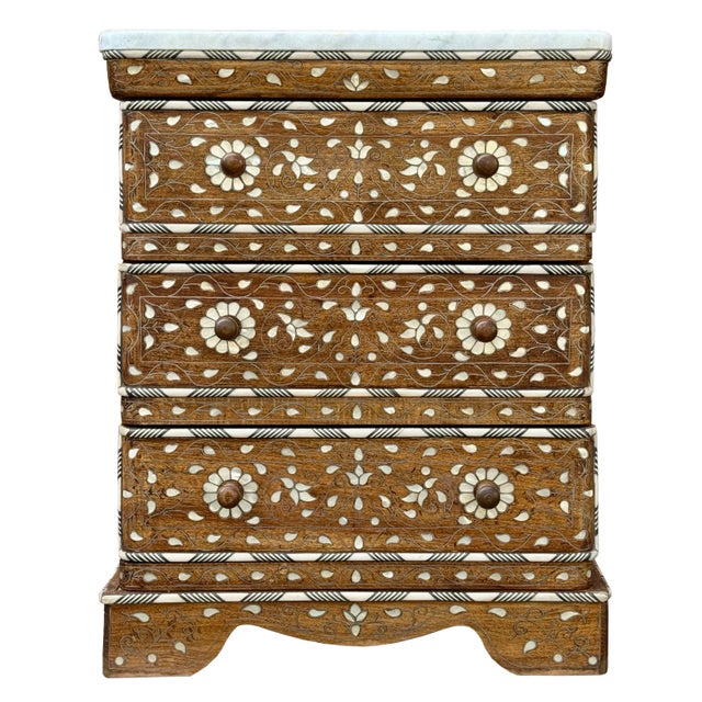 Fantastic vintage mother of pearl inlaid chest with drawers and marble top. 3 drawers with natural marble top. The natural...