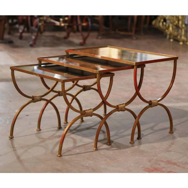 Elegant and sculptural, this set of three antique French nesting tables combines graceful Art Deco lines with neoclassical...