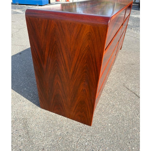 A beautiful example of Danish design in simplicity and quality. The rosewood grain is absolutely striking and really draws...