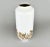 Tall white porcelain vase with golden decor by Hutschenreuther. Made in Germany in the 1970's. This piece is attributed to...