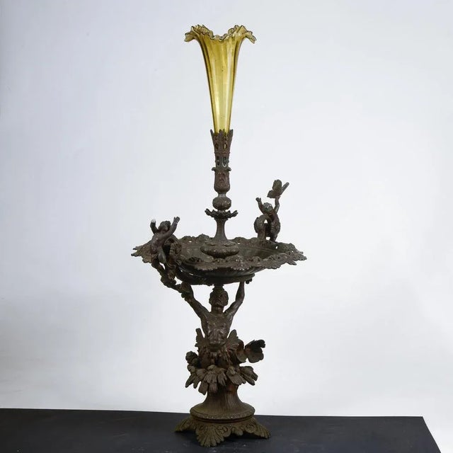 Metal centerpiece with decorations blown glass vase Triton decorations Amorini flowers and butterflies measures 54 x 39 x...