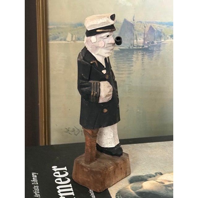 Gruff sea captain figurine, complete with pipe and peg leg. He looks dapper in his uniform. Most items found at Pub &...