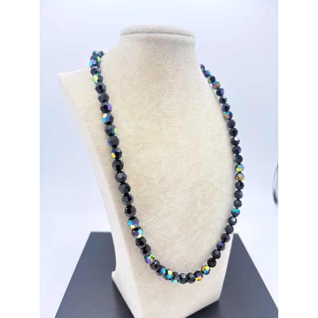 This necklace is a striking example of mid‑century European fine beadwork, pairing ultra-premium Czech faceted jet‑black...