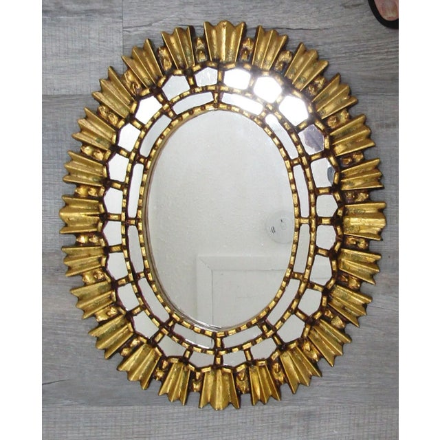 Peruvian Artisan Hand Crafted Gold Oval Wood Wall Mirror Handcrafted from mohena wood with mirrored accents, elegant rays...