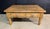 A larger Pine Coffee Table dating to the early 1900s, having 2 drawers to the front and original patina. In overall good...