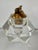 A faceted, lucite "ice cube" table lighter from the 1970s. The lighter part is made of brass and it can be removed from...