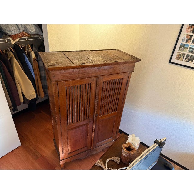 Beautiful antique solid wood cabinet featuring classic craftsmanship and warm, rich patina. This piece has two tall front...
