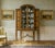 A neoclassical style display cabinet by waring & gillow. Dating to the early 20th century and of very good construction in...