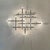 Very large, asymmetrical wall light made of chromed tubular steel, with 13 bulbs, some facing forward and others in...