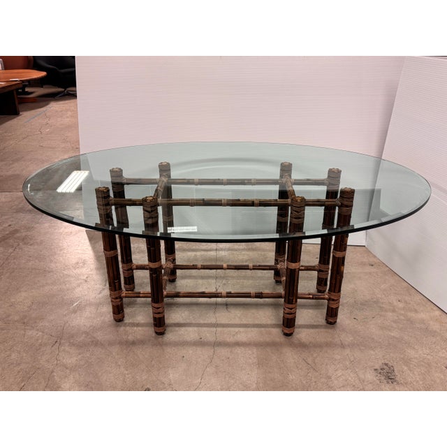 Design Plus Gallery presents a Vintage Bamboo Rattan + Glass Dining Table from McGuire Furniture. This dining table pairs...