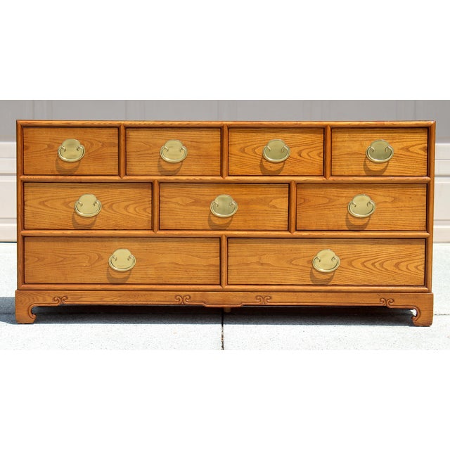 Elevate your space with this striking vintage nine-drawer dresser from the highly sought-after Chin Hua line, designed by...