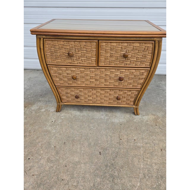 This chest has ample storage, great for a guest room. It comes with a glass inlay, for protection. The basket weave wicker...
