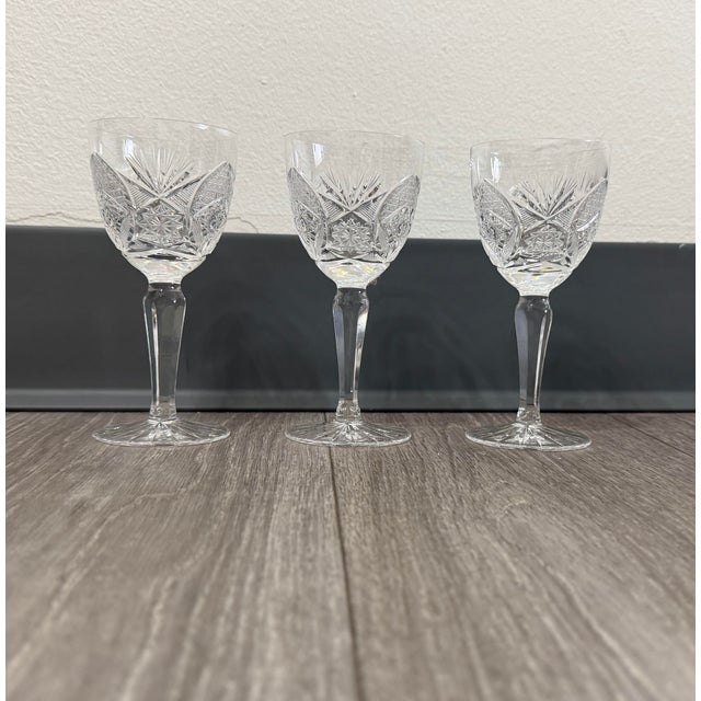 A beautifully matched set of three mid‑century cut crystal cordial glasses, featuring the classic Fan & Diamond pattern...