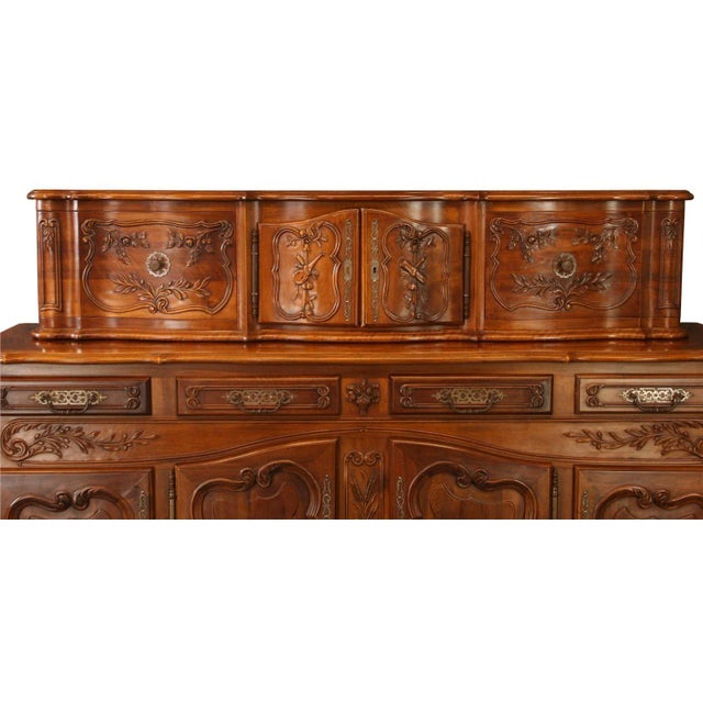 Vintage French Country walnut sideboard with beautiful carved details. Overall Condition is Used - Good. Shows normal wear...