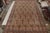 Hand-knotted in wool circa 1910-1920, this 9x17 antique Persian rug is a rare signature piece of Kerman Lavar...