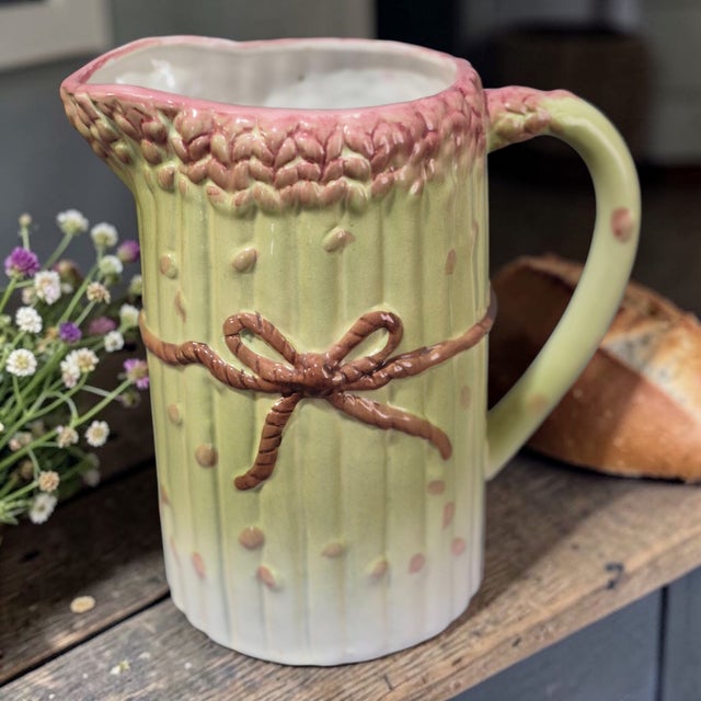 This Vintage Asparagus Motif Portuguese Majolica Ceramic Pitcher is a unique and decorative piece that adds a touch of...