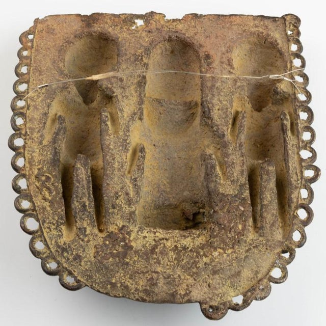 Notable for its artistic detail, this antique nigerian benin african bronze warriors sculpture wall plaque is a brilliant...