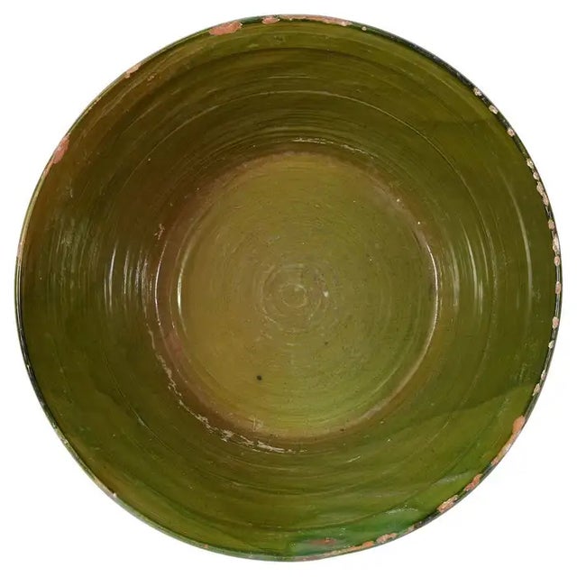 This provencal glazed terracotta bowl, hailing from 19th-century France, is a stunning example of traditional French...