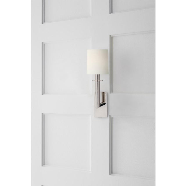 Dalston Sconce in Polished Nickel with Linen Shade Designer: J. Randall Powers Finish: Polished Nickel Height: 23.75"...