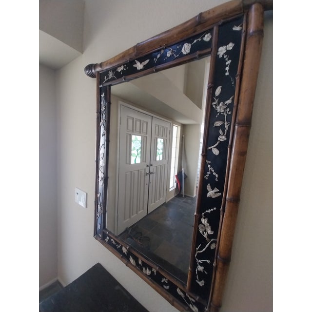 Beautiful and unusual vintage Asian wall mirror measuring approximately 30" wide × 42½" high. The substantial carved...