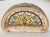 An absolutely beautiful French Victorian antique stained glass panel arched transom window that must be viewed in person...