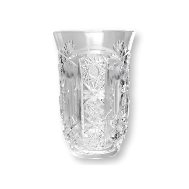 Mid 20th century American brilliant cut crystal tumblers featuring intricate starburst patterns with deeply faceted...